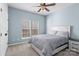Cozy bedroom with two windows, white furniture, and soft carpet at 1840 Sapona Ct, Denver, NC 28037