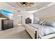 Comfortable bedroom showcases carpeting and beach view on television at 1840 Sapona Ct, Denver, NC 28037