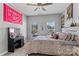 Light-filled bedroom showcases two windows and decorative posters at 1840 Sapona Ct, Denver, NC 28037
