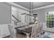 Elegant dining room with chandelier, table set, and ample seating at 1840 Sapona Ct, Denver, NC 28037