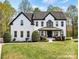 Charming two-story brick home with manicured lawn and inviting curb appeal at 1840 Sapona Ct, Denver, NC 28037