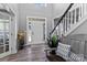 Welcoming foyer with hardwood floors, staircase, and natural light at 1840 Sapona Ct, Denver, NC 28037