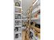 A well-organized pantry with custom shelving and a rolling ladder for easy access to stored goods at 1840 Sapona Ct, Denver, NC 28037