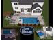 An aerial illustration showing a backyard oasis with a pool, spa, and entertainment area at 1840 Sapona Ct, Denver, NC 28037
