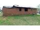 Damaged brick home with missing roof and charred features requiring renovation at 1842 Quail Run Dr, Kingstown, NC 28150