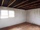 Modest interior view featuring a room with painted walls, wooden floor, and a window view at 1842 Quail Run Dr, Kingstown, NC 28150