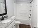 Updated bathroom featuring a shower-tub combo, granite vanity, and sleek fixtures at 2021 Hilton Way Rd, Lancaster, SC 29720