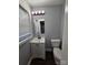 The bathroom has a white vanity and toilet, offering a clean and functional space at 2021 Hilton Way Rd, Lancaster, SC 29720