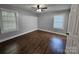 Cozy bedroom with hardwood floors, neutral paint, a ceiling fan and plenty of natural light at 2021 Hilton Way Rd, Lancaster, SC 29720