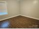 This bright and airy bedroom features modern ceiling fan and wood floors at 2021 Hilton Way Rd, Lancaster, SC 29720