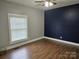 Bright bedroom features modern ceiling fan, wood floors, and accent wall for a cozy ambiance at 2021 Hilton Way Rd, Lancaster, SC 29720