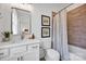 Bathroom featuring a sleek vanity with marble countertop, modern fixtures, and stylish decor accents at 221 Davidson Gateway Dr, Davidson, NC 28036