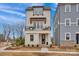 Charming two-story home featuring a cozy balcony, well-manicured landscaping, and inviting curb appeal at 221 Davidson Gateway Dr, Davidson, NC 28036