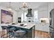 Spacious kitchen with an island featuring barstool seating and modern lighting fixtures at 221 Davidson Gateway Dr, Davidson, NC 28036