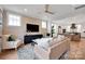 Open-concept living room with comfortable seating, natural light, and seamless flow to the dining area at 221 Davidson Gateway Dr, Davidson, NC 28036