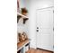 Functional mudroom includes a bench with storage and a door, perfect for organization at 221 Davidson Gateway Dr, Davidson, NC 28036