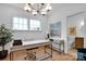 Bright office space with natural light, a modern desk, and elegant decor at 221 Davidson Gateway Dr, Davidson, NC 28036
