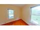 Bright bedroom with polished wood floors and natural light from two windows at 224 Mcclain St, York, SC 29745
