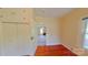 View of bedroom with wood floors, an overhead light, a window, and a doorway at 224 Mcclain St, York, SC 29745
