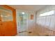 Sunny breakfast nook featuring vintage wallpaper and built-in storage at 224 Mcclain St, York, SC 29745