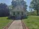 Inviting one-story house featuring a covered front porch and sidewalk at 224 Mcclain St, York, SC 29745