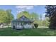 Charming home exterior with a well-maintained lawn and lush surrounding greenery at 224 Mcclain St, York, SC 29745