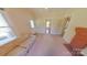 Bright living room with a vintage couch, fireplace, and natural light at 224 Mcclain St, York, SC 29745