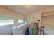 Utility room with a water heater, a sink, and lots of natural light from windows at 224 Mcclain St, York, SC 29745