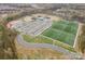 Aerial view showcasing community recreational facilities, including baseball fields, soccer fields, tennis court and ample parking at 2332 Paddlers Cove Dr, Lake Wylie, SC 29710