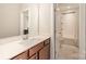 Stylish full bathroom showcasing granite countertops, white subway tile, and dark cabinets at 2332 Paddlers Cove Dr, Lake Wylie, SC 29710