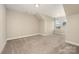 Spacious room featuring plush carpeting, natural light, and slanted ceilings at 2332 Paddlers Cove Dr, Lake Wylie, SC 29710