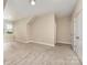 Spacious room featuring plush carpeting, natural light, and slanted ceilings at 2332 Paddlers Cove Dr, Lake Wylie, SC 29710