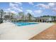 Community swimming pool with ample lounging space, perfect for residents to enjoy a refreshing swim and social activities at 2332 Paddlers Cove Dr, Lake Wylie, SC 29710