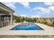 Backyard pool and hot tub with an outdoor patio, lounge chairs and landscaped yard at 2332 Paddlers Cove Dr, Lake Wylie, SC 29710
