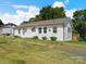A charming ranch style home with a well-kept lawn and tidy landscaping at 2633 N Sharon Amity Rd, Charlotte, NC 28205