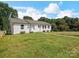 Charming single-story home featuring a well-manicured lawn and tidy landscaping at 2633 N Sharon Amity Rd, Charlotte, NC 28205