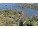 Beautiful Lake Norman waterfront property with a canopy of mature trees and private docks at 2792 Lakeshore Rd, Denver, NC 28037
