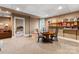 Finished basement includes a table with seating area, couch, bookshelves, and access to another room at 2792 Lakeshore Rd, Denver, NC 28037