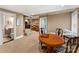 Finished basement features a table with seating, couch, bathroom, and access to another room at 2792 Lakeshore Rd, Denver, NC 28037