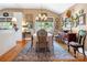 Charming dining room with natural light, complemented by hardwood floors and decor at 2792 Lakeshore Rd, Denver, NC 28037