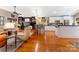 Open-concept living area with hardwood floors, fireplace, and island for entertaining at 2792 Lakeshore Rd, Denver, NC 28037