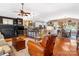 Open-concept living space with hardwood floors, connecting living, dining, and kitchen areas at 2792 Lakeshore Rd, Denver, NC 28037