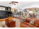 Comfortable living room flows into kitchen, with hardwood floors and a cozy fireplace at 2792 Lakeshore Rd, Denver, NC 28037