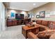 Basement living room with dark wood entertainment center, TV, comfortable sectional couch, and carpet flooring at 2792 Lakeshore Rd, Denver, NC 28037