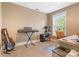 Cozy home office features a keyboard, guitar, desk, and natural light from a bright window at 2792 Lakeshore Rd, Denver, NC 28037