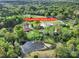 Aerial view of property, highlighting home, pond, sheds, and surrounding lush greenery and landscape at 3017 Lynwood Dr, Lancaster, SC 29720