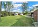 Expansive backyard with several outbuildings, offering plenty of space for outdoor activities and storage at 3017 Lynwood Dr, Lancaster, SC 29720