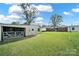Spacious backyard featuring a metal shed and view of the back of the brick house at 3017 Lynwood Dr, Lancaster, SC 29720