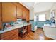 View of the bathroom featuring a built in desk, blue tiles and white cabinets at 3017 Lynwood Dr, Lancaster, SC 29720