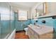 Bathroom features blue tiling in shower and around the walls at 3017 Lynwood Dr, Lancaster, SC 29720